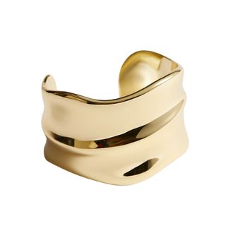 Cut out image of a gold wavy cuff from & Other Stories