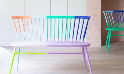 A colourful ercol loveseat designed by 2LG Studio