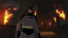 The Dark Knight stands in a burning building in Batman: Caped Crusader on Prime Video