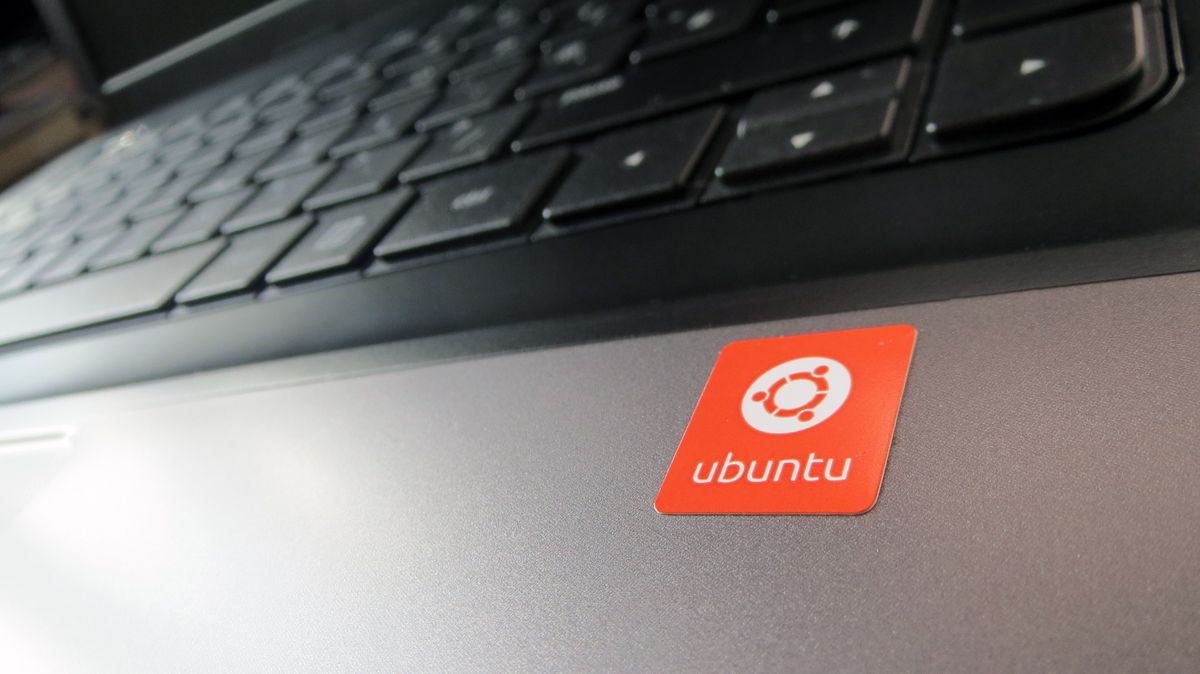 Ubuntu logo next to a computer keyboard