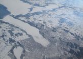 The snow-covered city of Barrie, Ontario, Canada, surrounds ice-bound Lake Simcoe in this view from NASA's DC-8 airborne science laboratory during a flight Feb. 20 in NASA's Global Precipitation Measurement Cold-season Precipitation Experiment, or GCPEx, mission