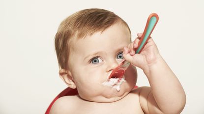 Finger, Child, Neck, Taste, Kitchen utensil, Toddler, Eyelash, Spoon, Nail, Baby, 