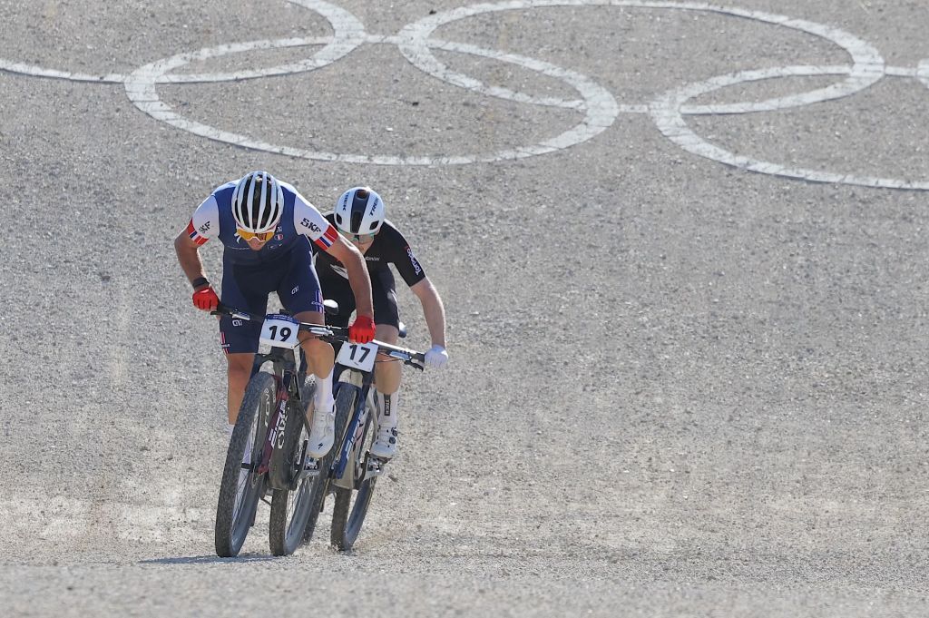Frances Victor Koretzky sprints to the finish line followed by New Zealands Anton Cooper during the Mens Elite Cross Country mountain biking test event at Elancourt Hill in Elancourt west of Paris on September 24 2023 Photo by Thomas SAMSON AFP Photo by THOMAS SAMSONAFP via Getty Images
