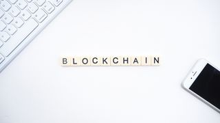 blockchain spelt out on a desk in scrabble counters