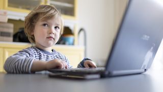 BONN, GERMANY - MARCH 20: In this photo illustration Child playing at a laptop on March 20, 2022 in Bonn, Germany. (Photo Illustration by Ute Grabowsky/Getty Images)