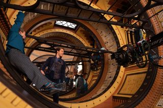 Actors are filmed in a circular wooden set from 'Wicked Part One.'