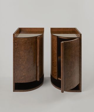 a pair of stained maple bedside cabinets 