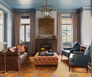 formal living room with muted blue and dark orange color scheme