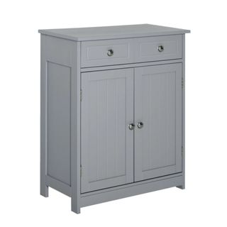 A dark gray freestanding bathroom cabinet with pannelled doors and silver round handles