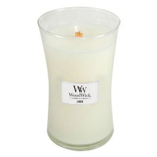 A white linen candle with wooden wick