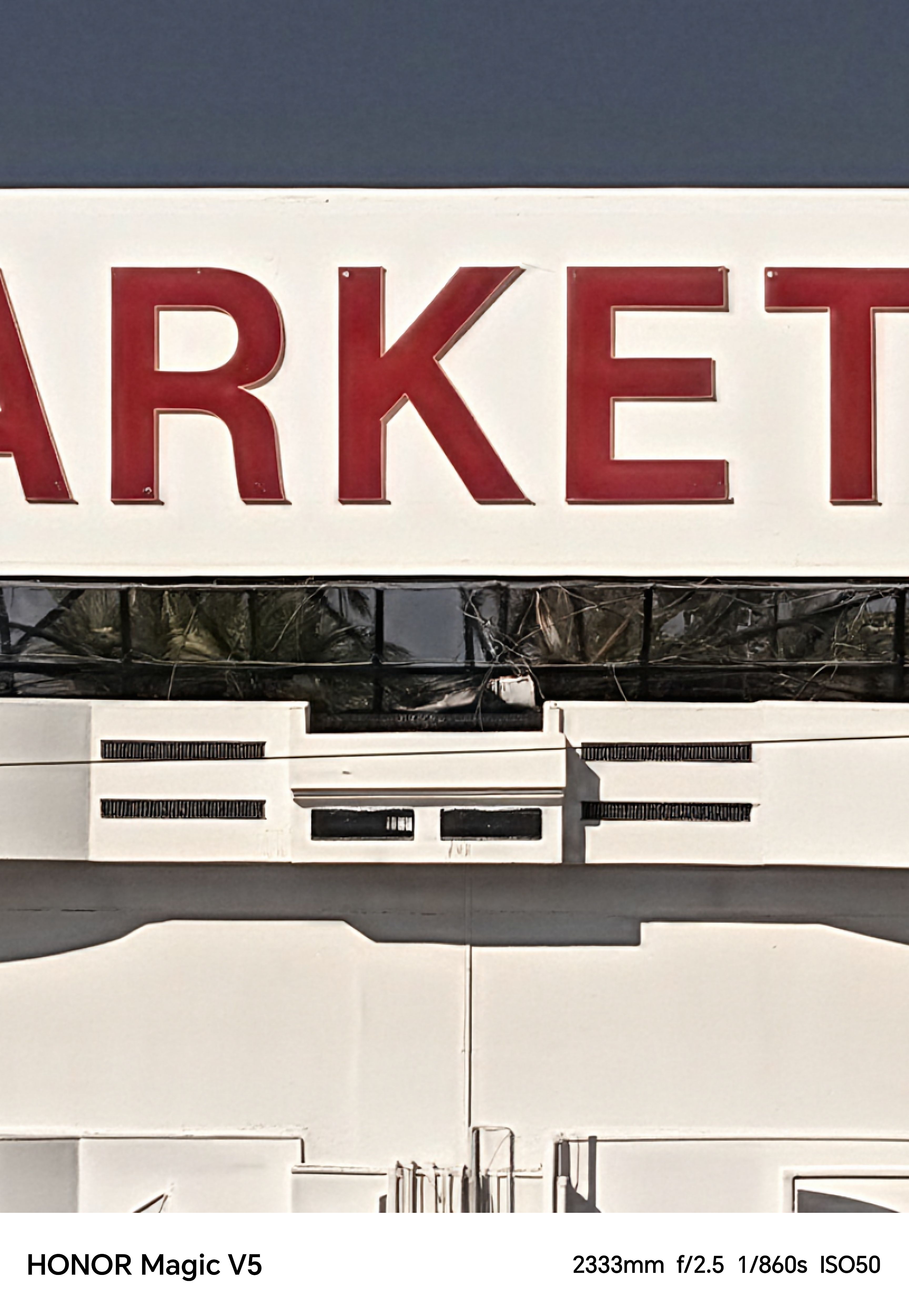 Close up of a sign above a shop reading RKET