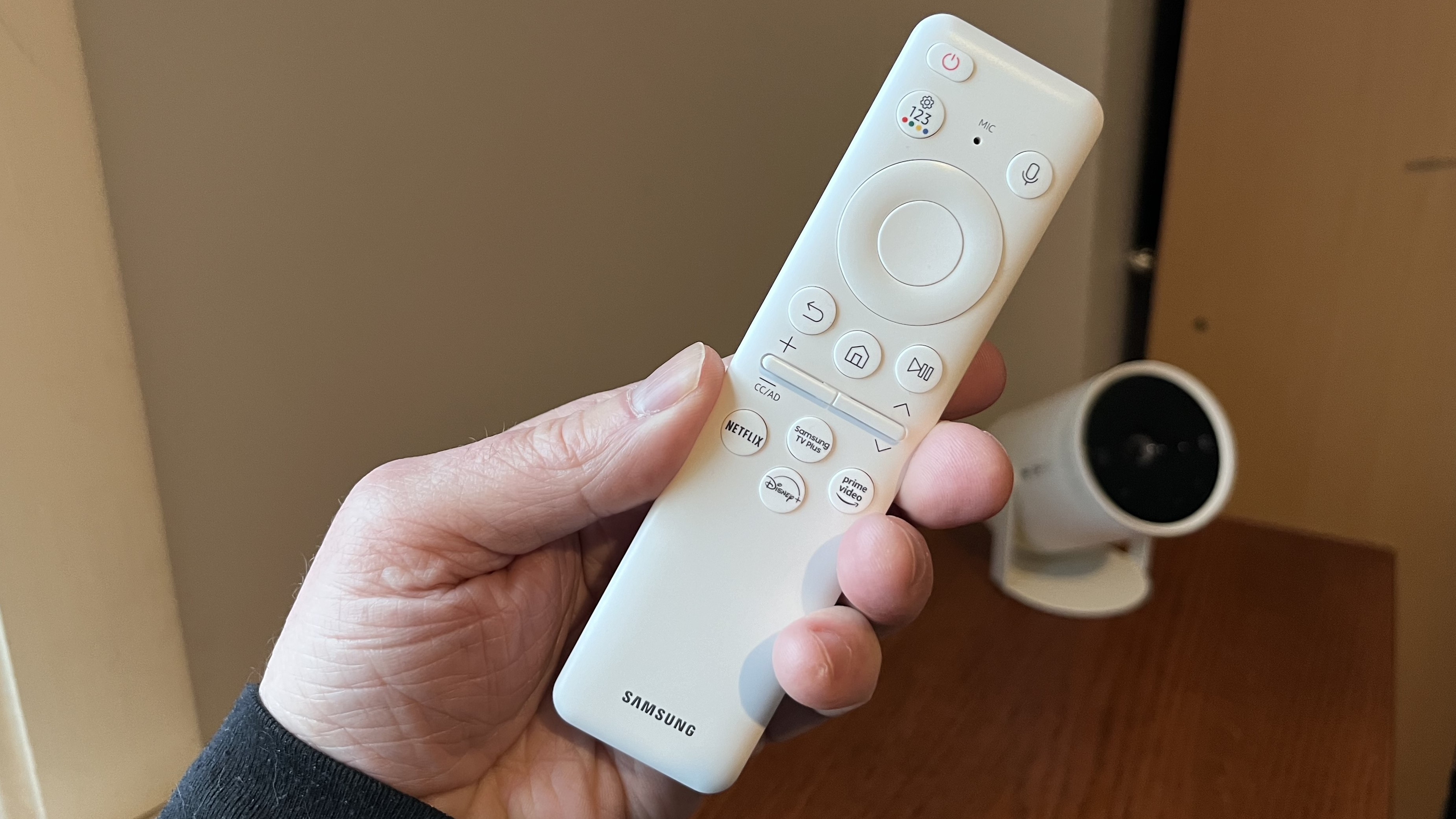 Samsung The Freestyle 2nd Gen remote control held in hand