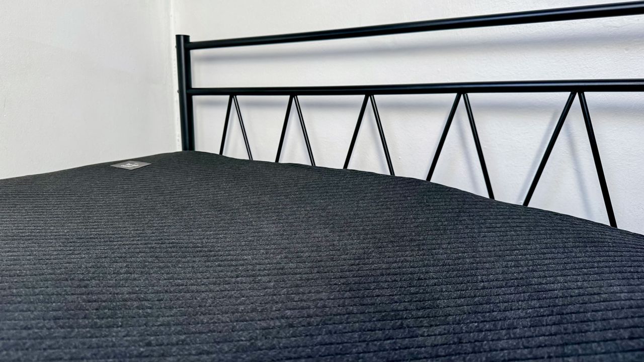 Eight Sleep Pod 4 black mattress cover on bed