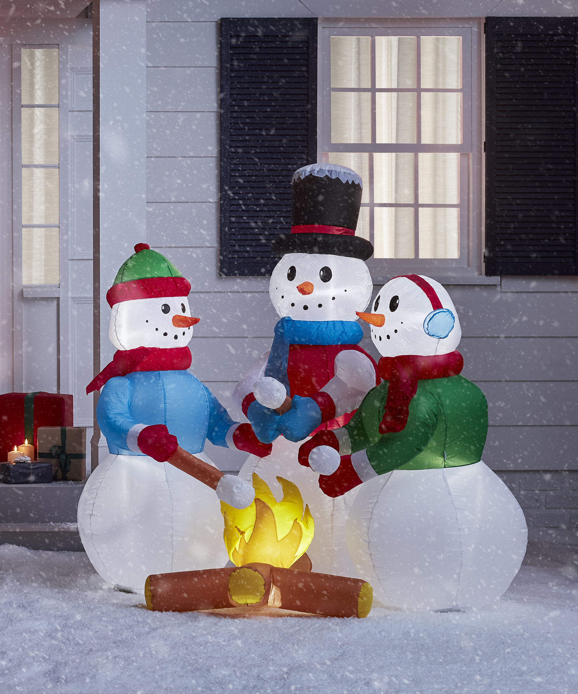 Dressed snowmen round the fire Christmas inflatable with marshmallows