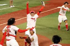 Japanese softball team celebrates gold medal.