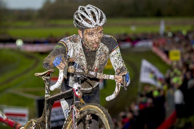A mud-splattered Niels Albert (BKCP-Powerplus) in action at Jaarmarktcross Niel