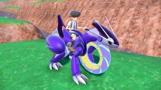 A trainer sat on Miraidon's back in Pokemon Violet.