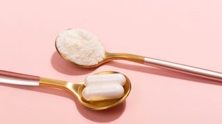 Collagen powder and pill on a pink background