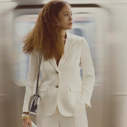 woman wearing white blazer and trousers