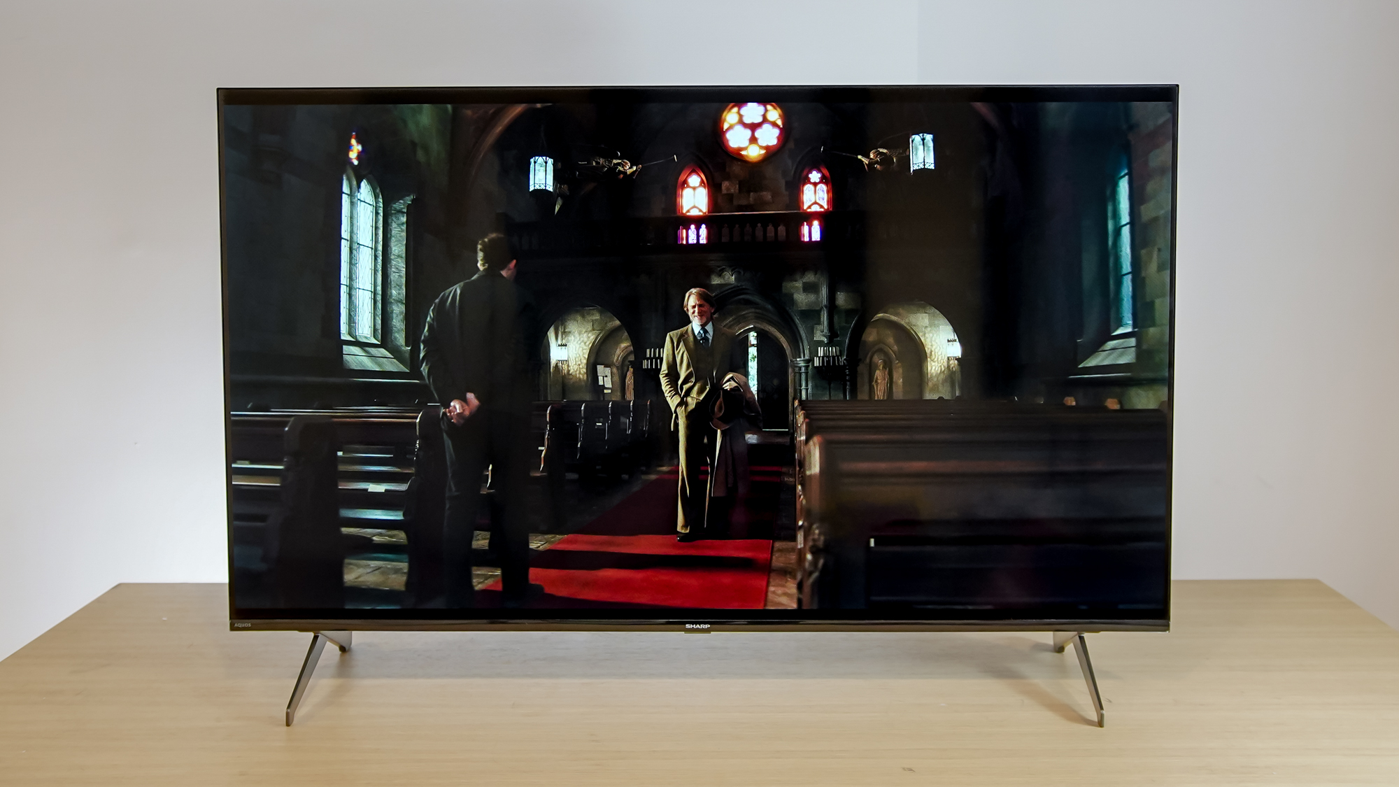 A Sharp Aquos QLED TV on a table