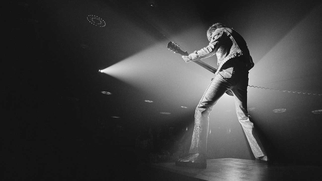 Guitarist Dave Peverett from British rock band Foghat performs live on stage in Waterbury, Connecticut, USA in February 1976