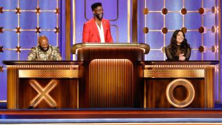 Nate Burleson appears alongside contestants on Hollywood Squares