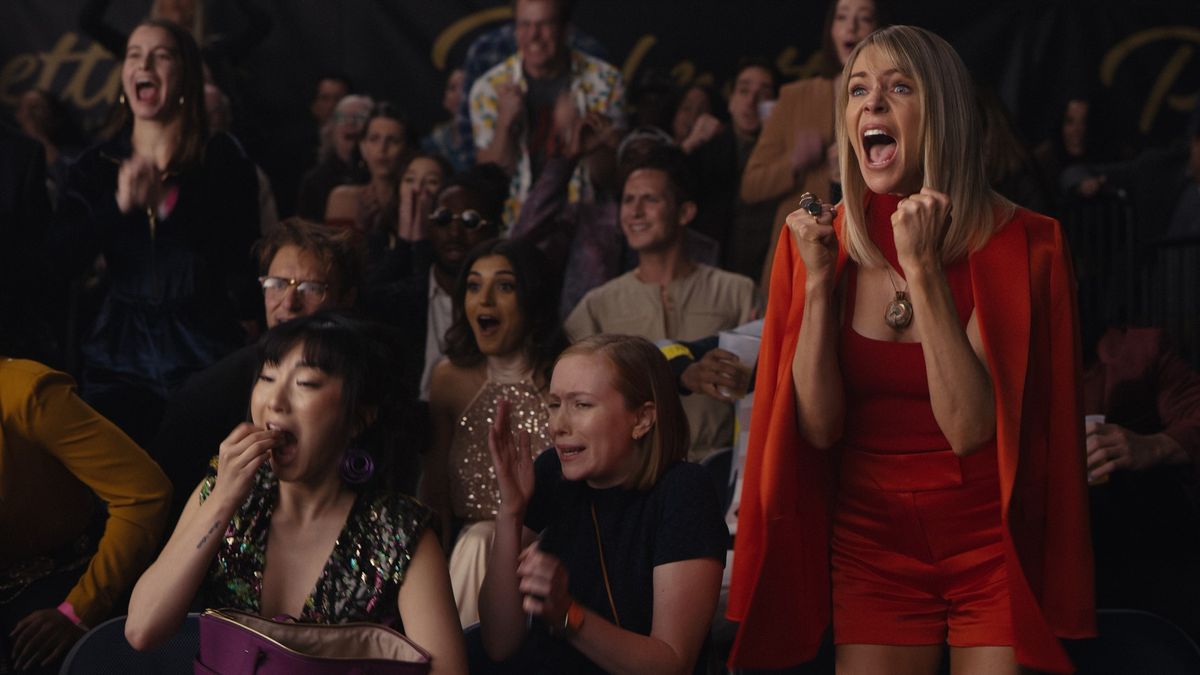 Poppy Liu, Hannah Einbinder and Kaitlin Olson watch a fight in Hacks