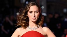Emily Blunt is pictured wearing rose-nude lipstick and a red dress at the "The Devil Wears Prada 2" European Premiere inside Leicester Square on April 22, 2026 in London, England. 