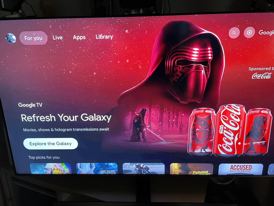 A photo of Google TV showing a big ad for coca-cola