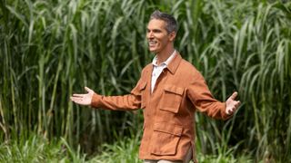 Ari Shapiro standing in a field in The Mole season 2