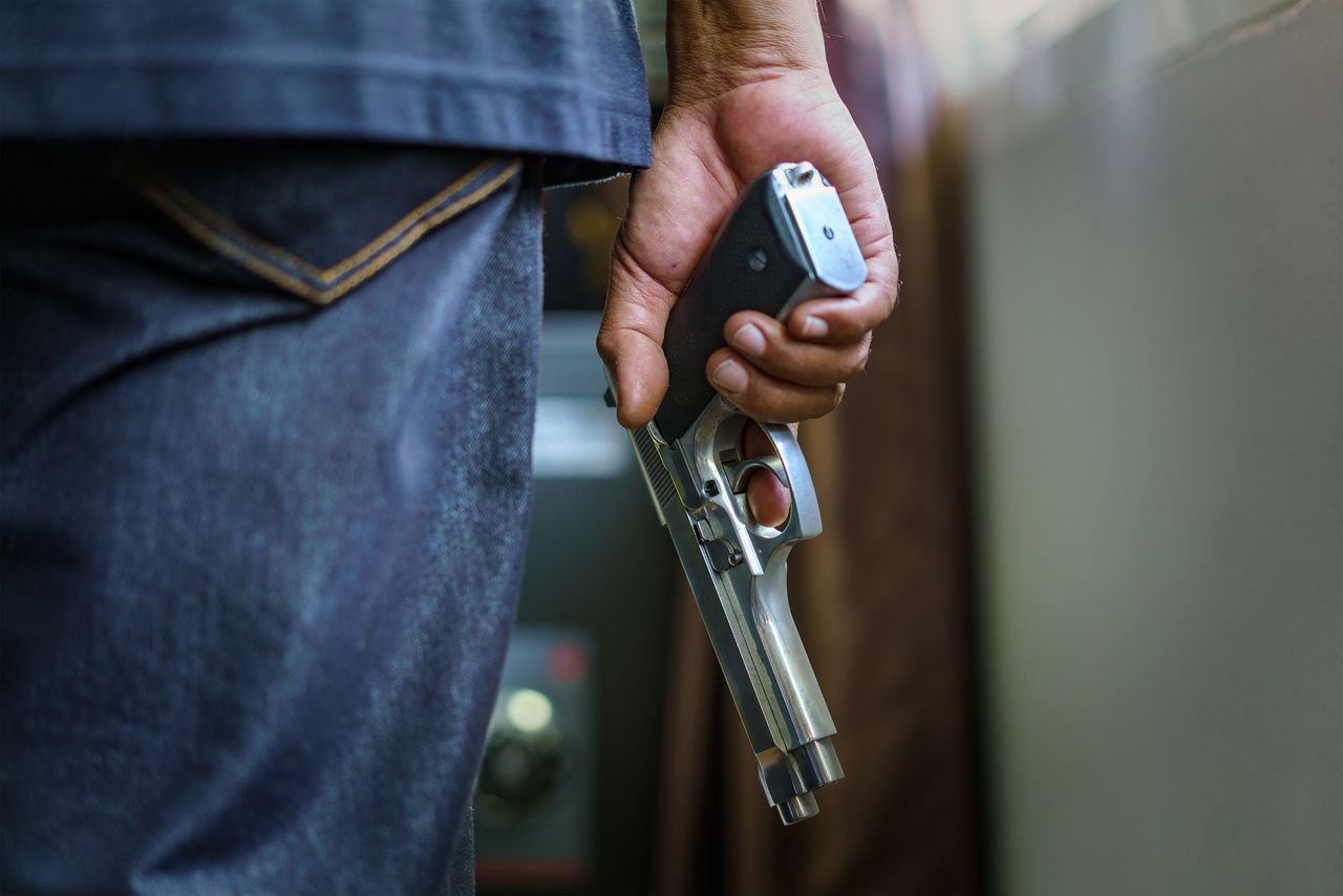 A man holding a gun. 