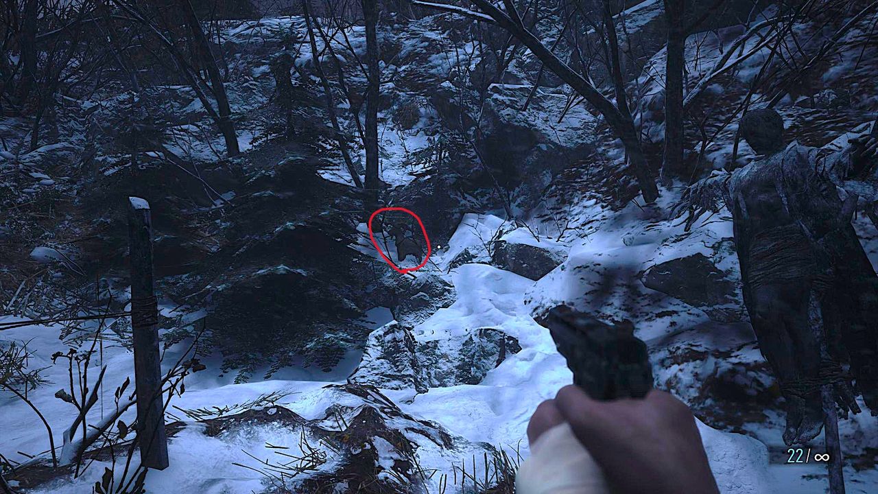 Edited in-game screenshot of a Goat of Warding in Resident Evil Village, with a red marking to highlight it's location.