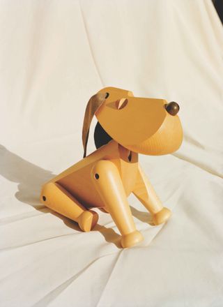 Wooden dog by hand bolling