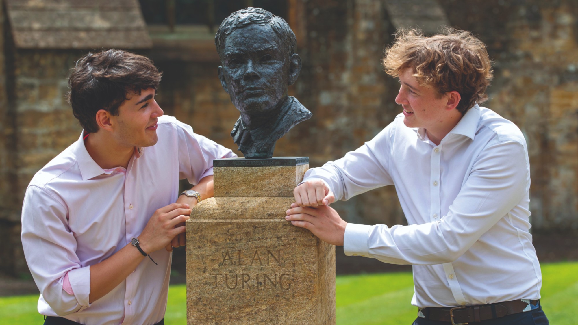 Sherborne pupils with a bust of Alan Turing