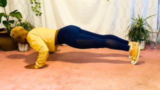 Personal trainer Elethia Gay demonstrates a push-up