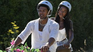 Timmy and Zeta riding a bike on Love Island USA season 4
