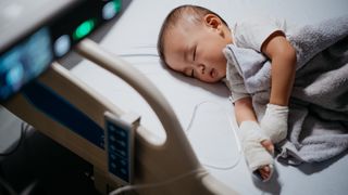 an infant in a hospital bed