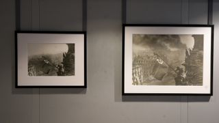 The two prints of the Soviet flag flying over the Reichstag in 1945 by by Yevgeny Khaldei, on display at The Camera Never Lies exhibition at the Sainsbury Centre in Norwich, England