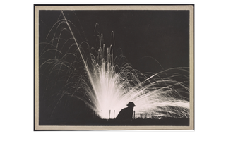 A black and white picture of a explosion with sprays.