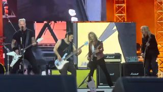 Metallica onstage in 2024 with Brian Tatler