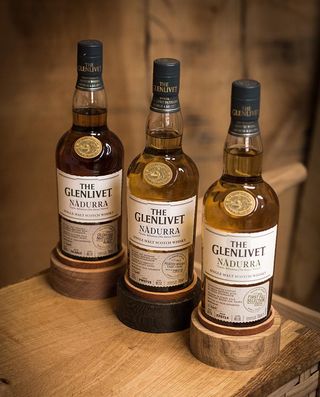 hree bottles of The Glenlivet whiskey.