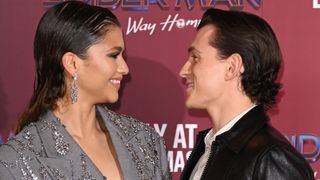 Zendaya and Tom Holland attend a photocall for "Spiderman: No Way Home" at The Old Sessions House on December 05, 2021 in London, England