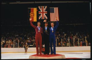 Robin Cousins on the Olympic podium at Lake Placid in 1980 having taken the men's ice skating gold.