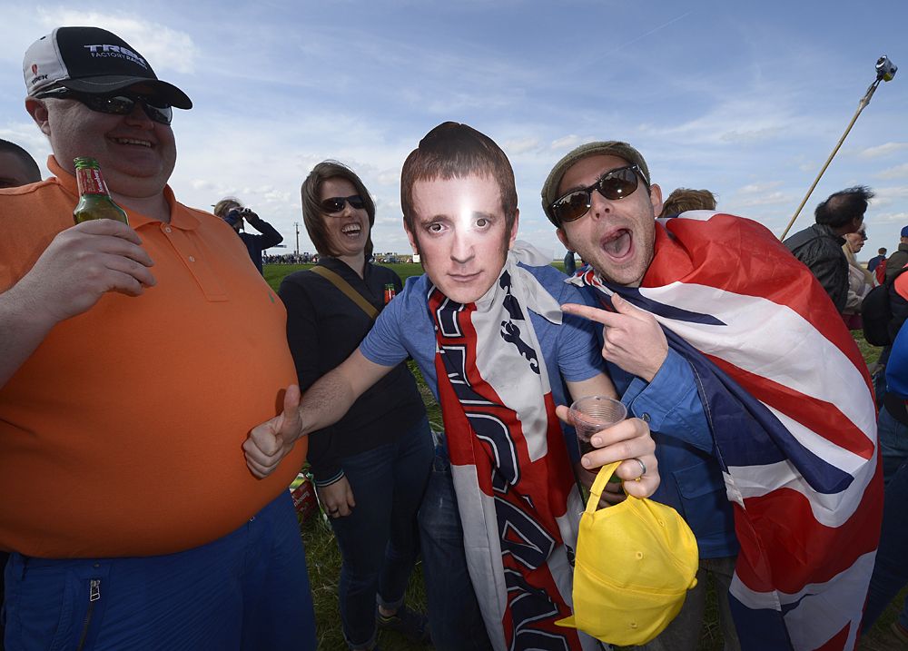 A fan wears a mask of Bradley Wiggins