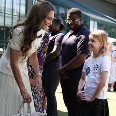 The Princess of Wales meeting 8-year-old Lydia Lowe from the Dan Maskell Tennis Trust at the Ladies' Singles Final during day thirteen of The Championships Wimbledon 2025 at All England Lawn Tennis and Croquet Club on July 12, 2025