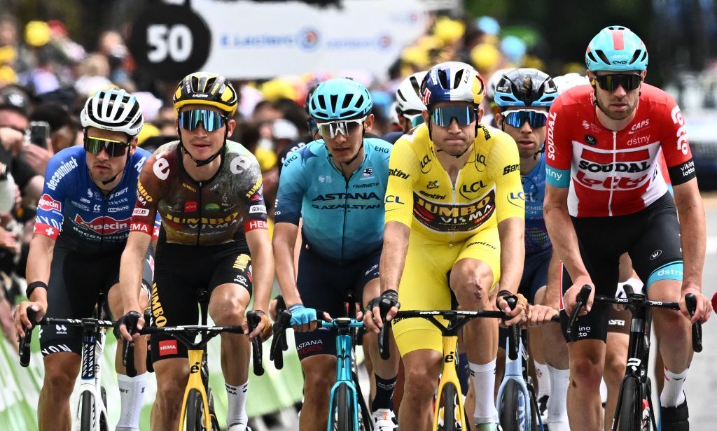 JumboVisma teams Belgian rider Wout Van Aert 3rd R cycles to the finish line at the back of the pack during the 6th stage of the 109th edition of the Tour de France cycling race 2199 km between Binche in Belgium and Longwy in northern France on July 7 2022 Photo by AnneChristine POUJOULAT AFP Photo by ANNECHRISTINE POUJOULATAFP via Getty Images