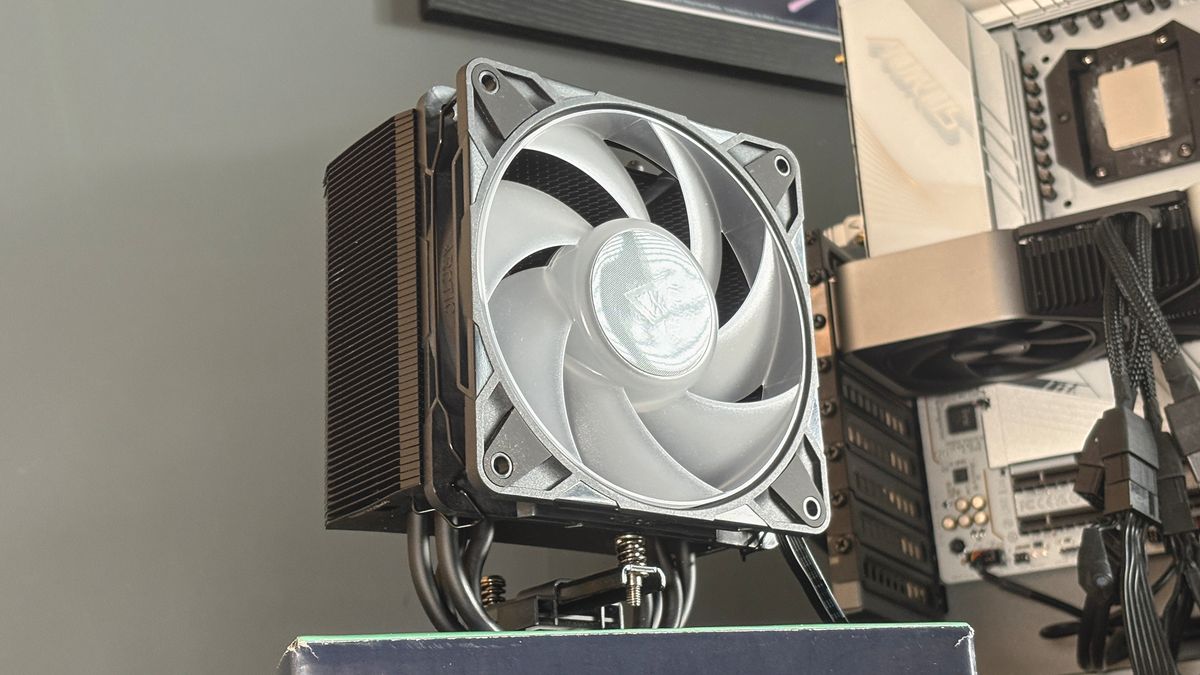An Arctic Freezer 36-S on a desk and installed in a gaming PC, with the Freezer 36 nearby.
