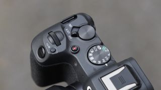 close up of buttons and dials on the Canon EOS R8 mirrorless digital camera