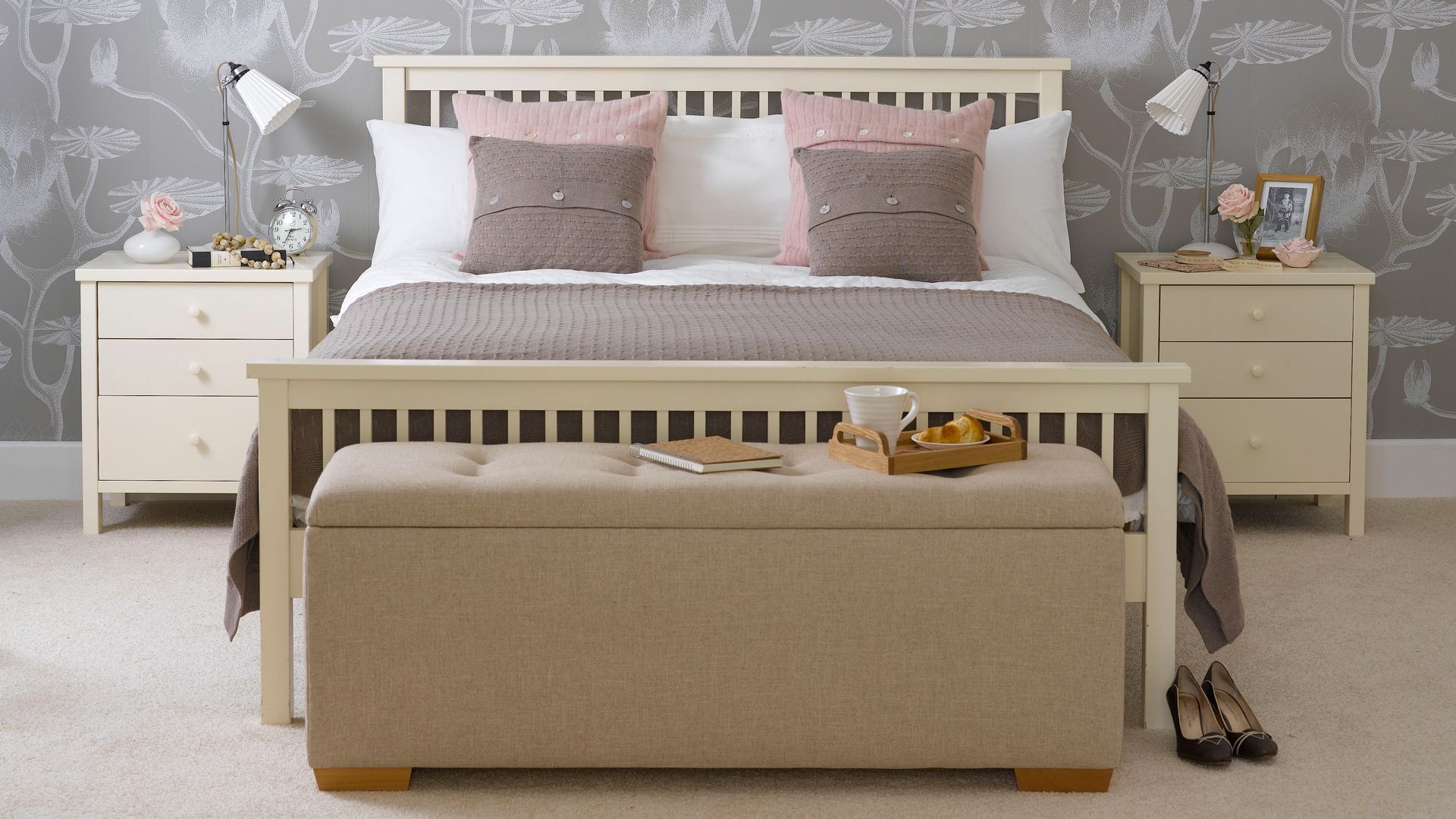 grey bedroom with botanical print wallpaper cream wooden bed with matching cream nightstands placed either side