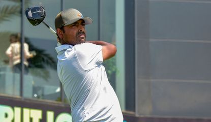 Anirban Lahiri hits a drive and watches his tee shot 